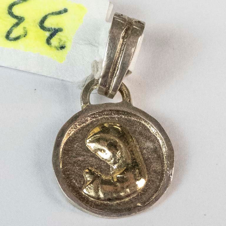 Lote anterior: Pendiente de plata y oro con diseño de peces