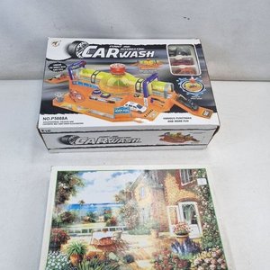 Lote siguiente: L 389 - 1 Lote - Lote variado con juego infantil de "Carwash" en caja y rompecabezas de 1000 piezas con diseño de jardín