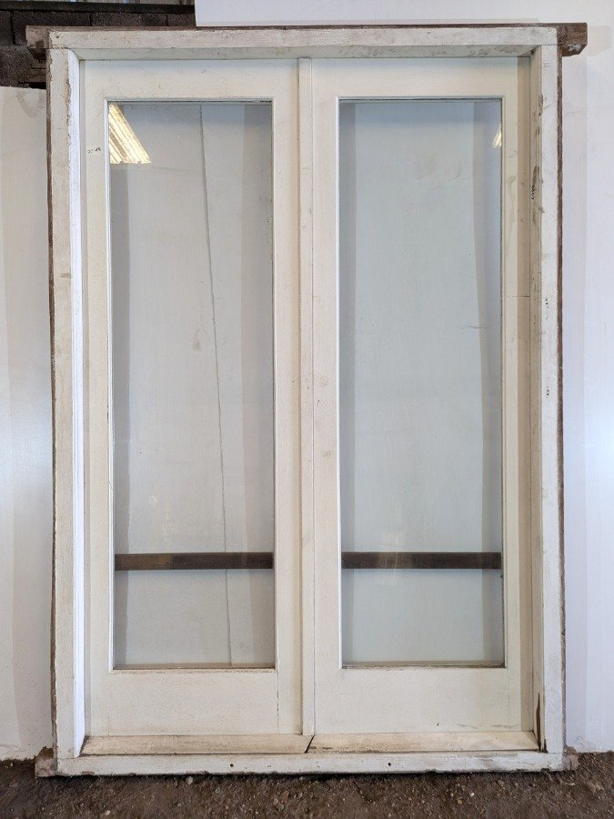 Puerta de madera con dos hojas batientes y marco en cedro - imagen 7