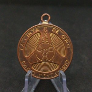 Lote siguiente: Medalla Radio Centenario CX36 "La Cinta de Oro" - Bronce