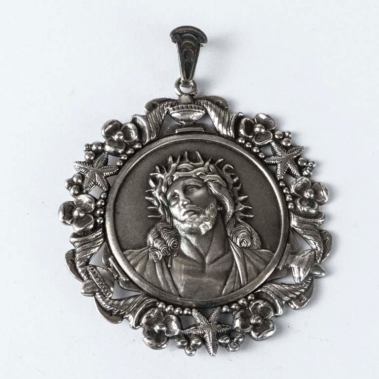 Lote siguiente: Medalla religiosa de plata