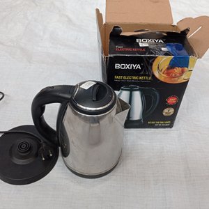 Tres piezas: jarra eléctrica + 2 tazas de café con tapa y cucharita. - imagen 4