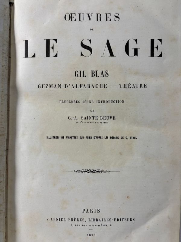 Libros antiguos con estatuas de león y oso polar - imagen 2