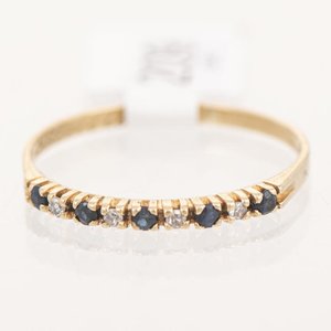 Lote siguiente: Anillo Medio Sin Fin Oro 18k con Brillantes Blancos y Negros