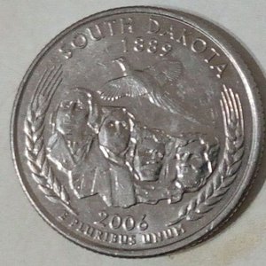Lote siguiente: Moneda Conmemorativa 50 State Quarters Dakota del Sur 2006