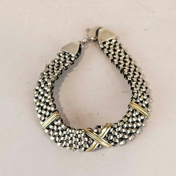 Lote siguiente: Pulsera de oro y plata con diseño doble