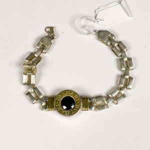 Lote anterior: Pulsera de Plata con Piedra Negra y Detalles Dorados